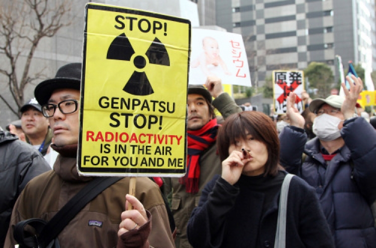 Protesters link arms around the world to decry nuclear power