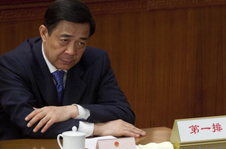 China says committed to probing political scandal