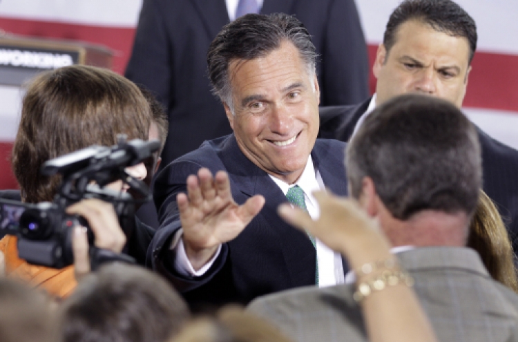 Romney, Obama battle over economy