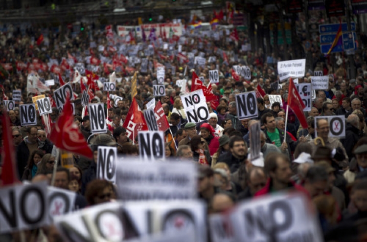 Tens of thousands protest in Spain against cuts