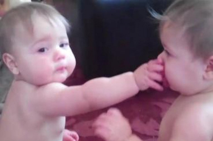 Twin sisters’ squabble over single pacifier becomes huge hit online