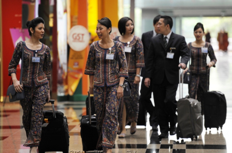 Asian airlines post slow growth on fuel