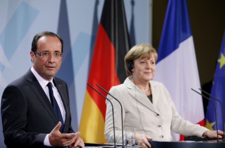 Merkel, Hollande say will keep eurozone together