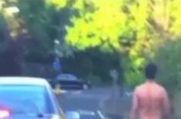 Naked man witnessed cruising down street