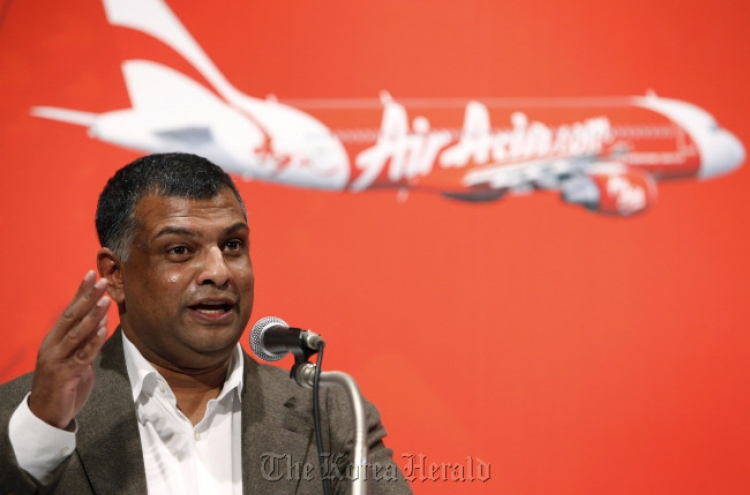 AirAsia parlays planes into phones, hotels