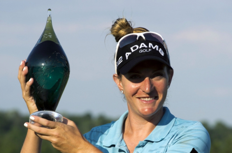 Lang endures playoff for 1st LPGA title