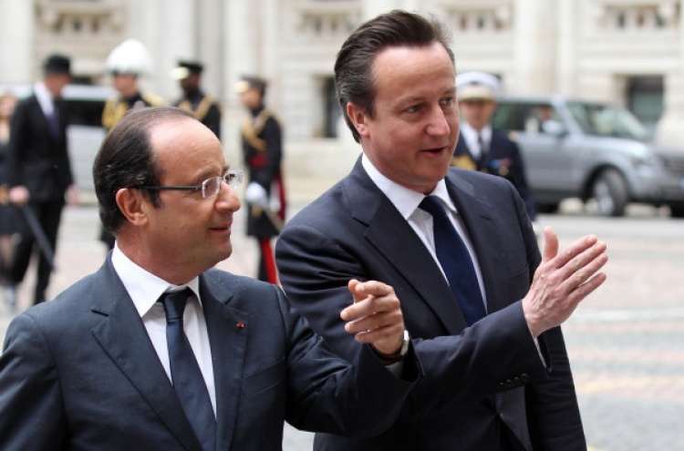 Hollande, Cameron laugh off differences