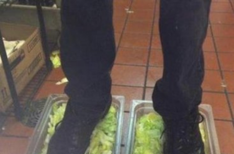 Workers fired over lettuce standing pic