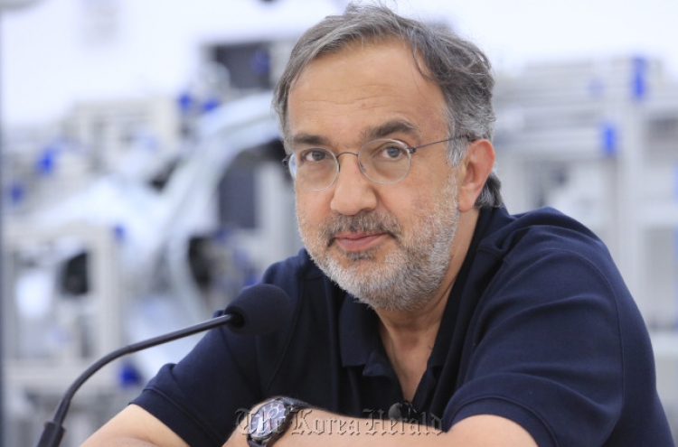 VW calls for Marchionne to quit as head of auto group