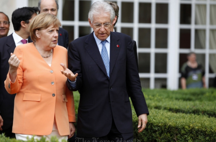 Merkel, Monti vow to protect eurozone