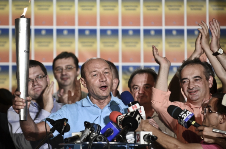 Basescu survives impeachment vote