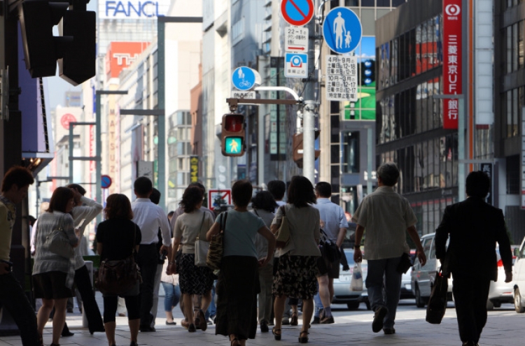 IMF says Japan recovering, but faces risks