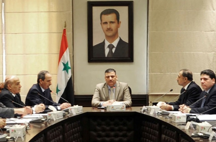 Syrian P.M. joins rebel side in latest blow to Assad