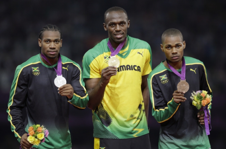 Bolt wins 200, Rudisha gets 800 record at Olympics