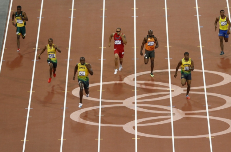 Usain Bolt first man to duplicate 100-200m Olympic double