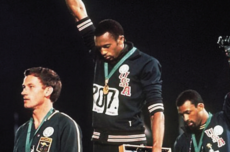 Apology offered to athlete on black power podium