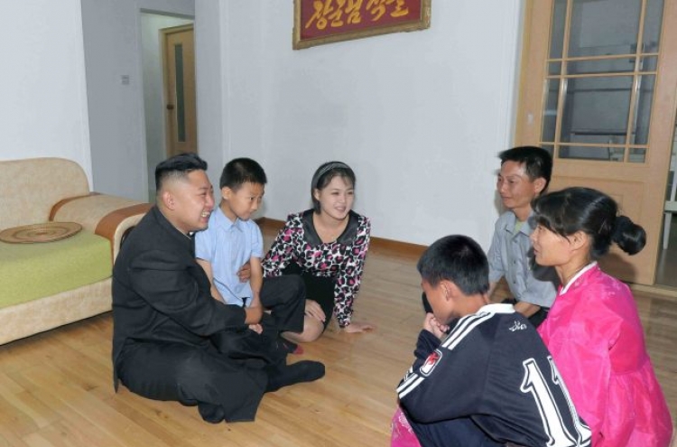 Kim visits homes of workers
