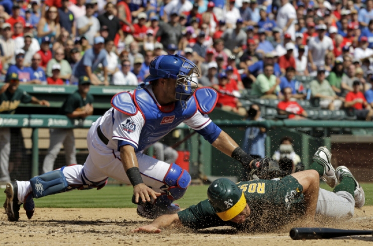 Rangers down A’s 9-7 for split