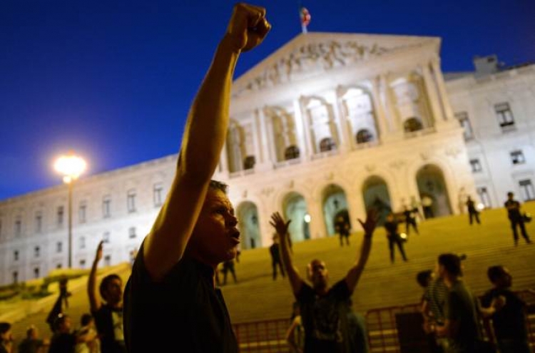 Portugal hikes more taxes to cut debt