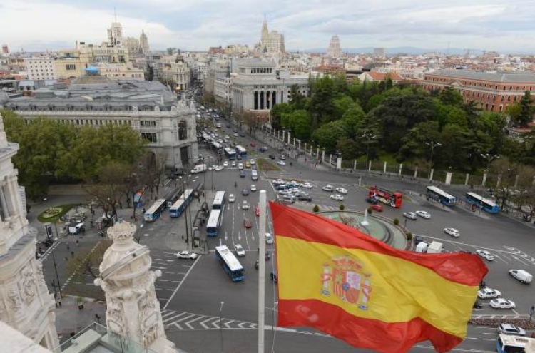 S&P cuts Spain rating to near junk