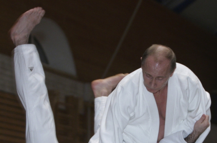 Sports-mad Putin promoted to the eighth dan in judo