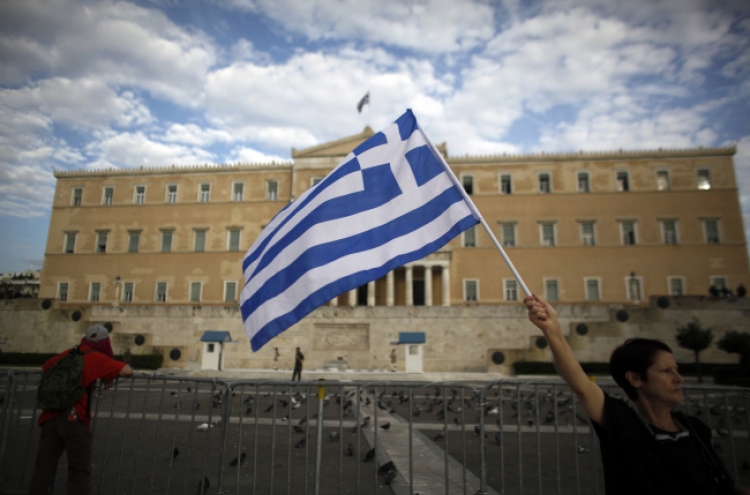 Troika hopes for Greek debt deal within days