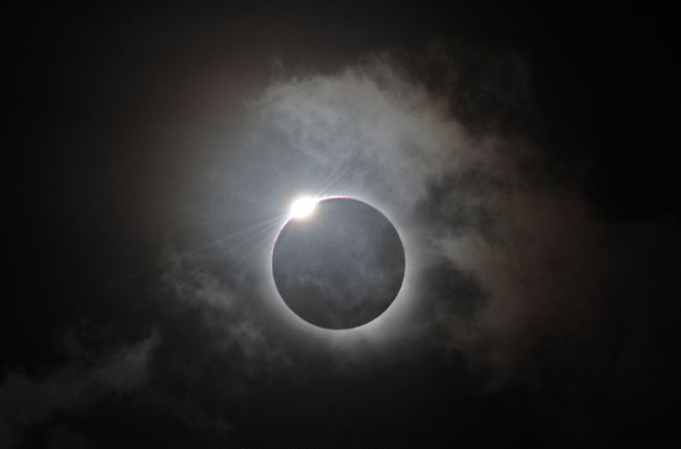 Sky-gazers in awe of total eclipse