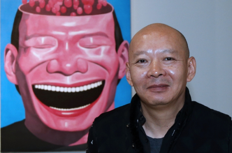 Chinese art star Yue brings ‘laughing men’ to Europe
