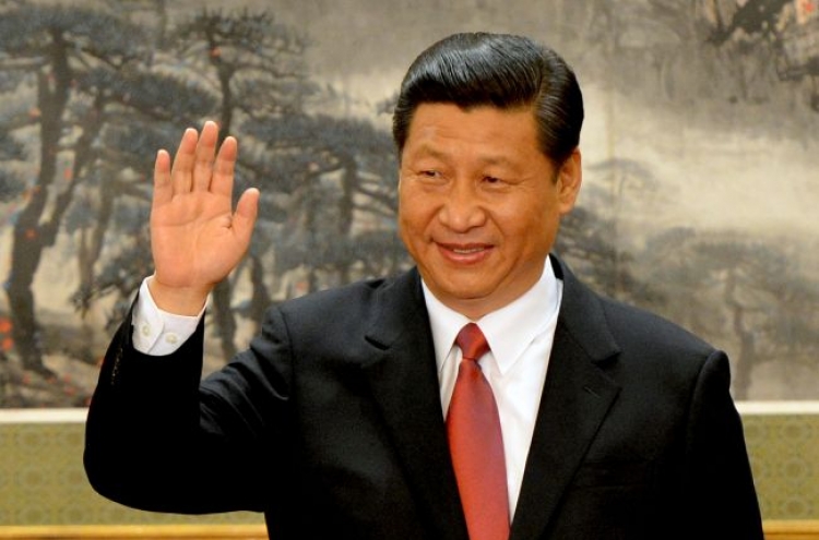 Xi takes helm amid reform calls