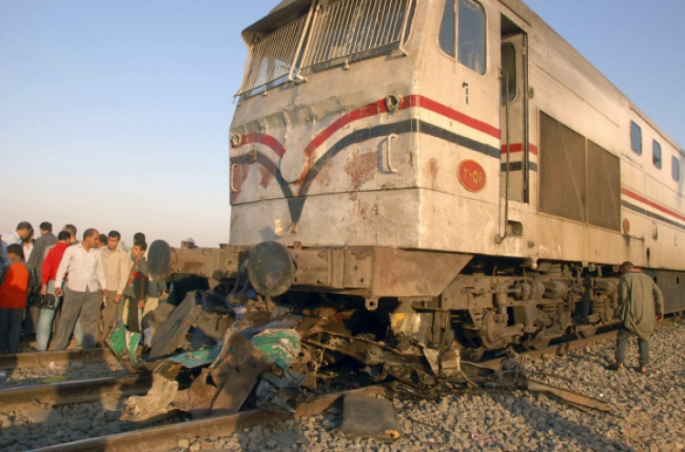 Egyptian train hits school bus, at least 51 killed