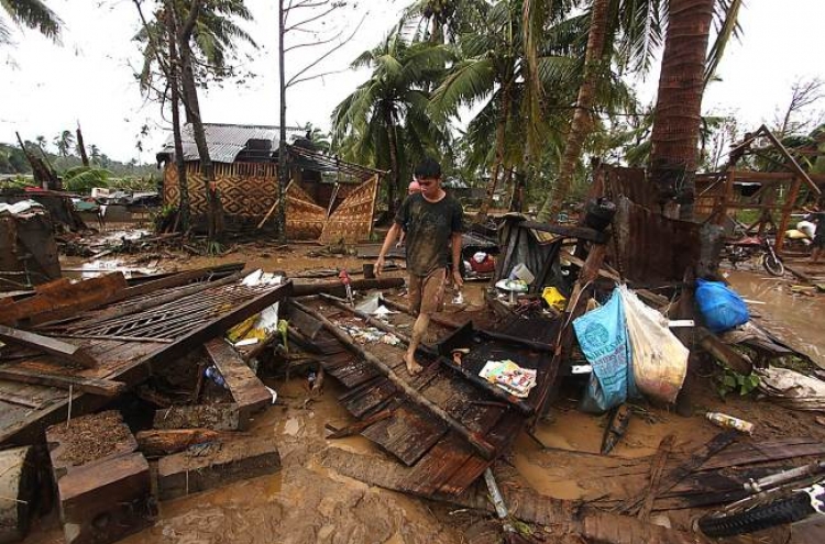 Powerful typhoon kills at least 74 in Philippines