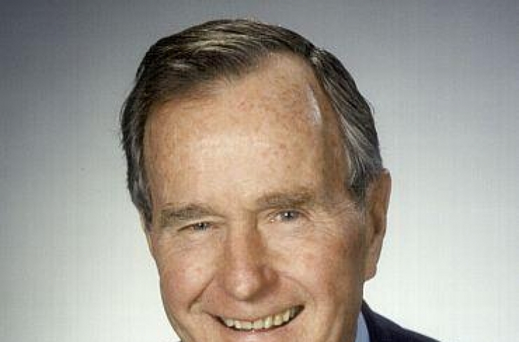 Ex-U.S. President H.W. Bush remains  hospitalized, stable