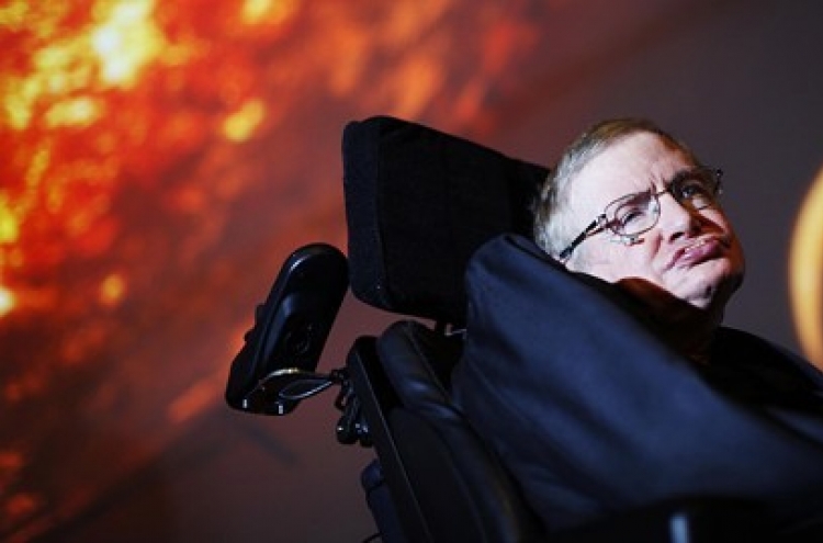 Stephen Hawking conjures black hole in ad