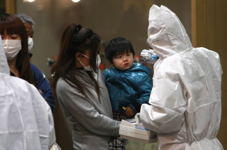 Japanese flee Fukushima to faraway Okinawa