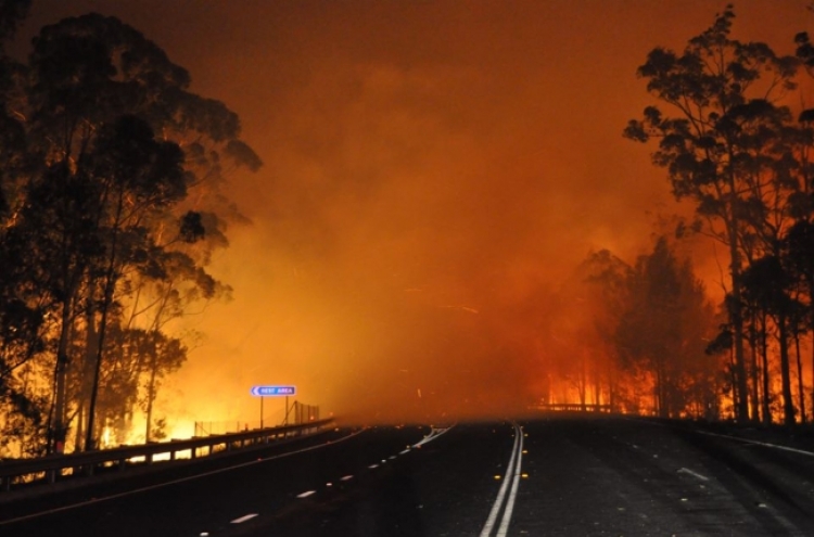 Cooler weather helps Australian firefighters