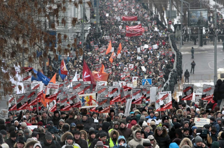 Thousands march in Moscow to protest Russia’s adoption ban