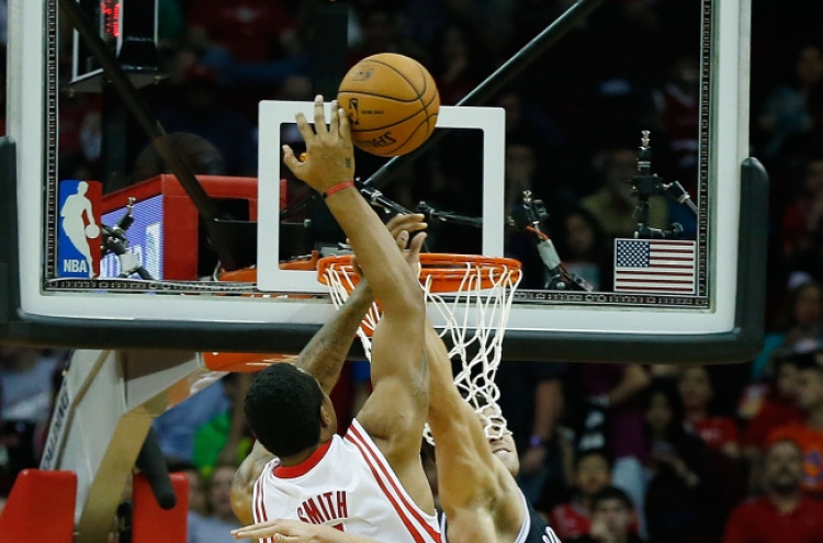 Harden, Asik lead Rockets past Nets