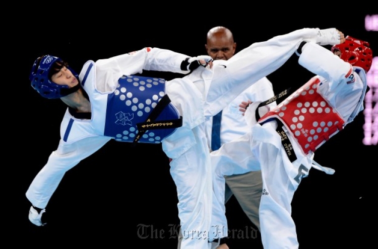 Olympics drops wrestling, keeps taekwondo