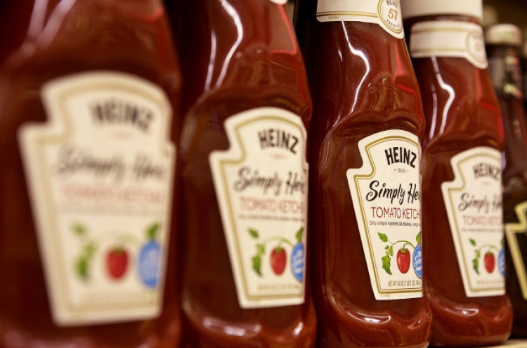 Buffett buys Heinz for $23 billion