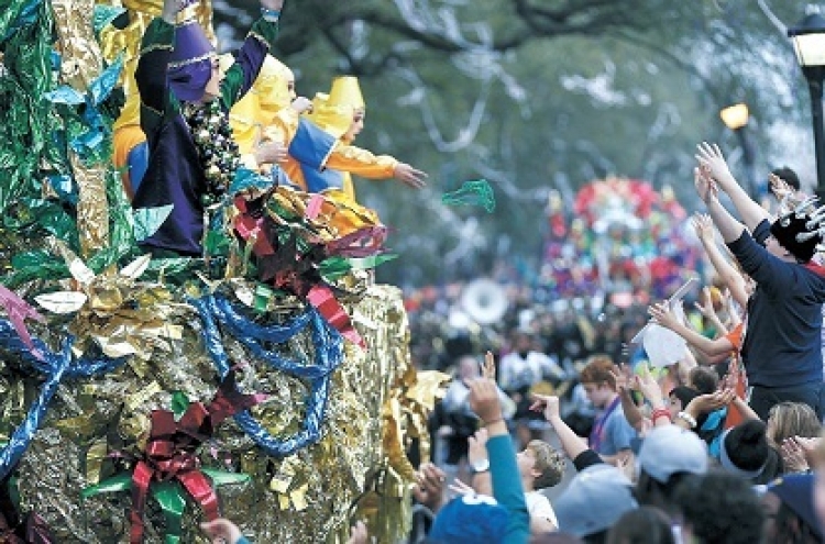 Raindrops, gloomy skies can’t stop Mardi Gras