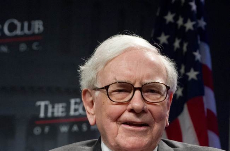 Buffett firm’s profits rise on paper gains