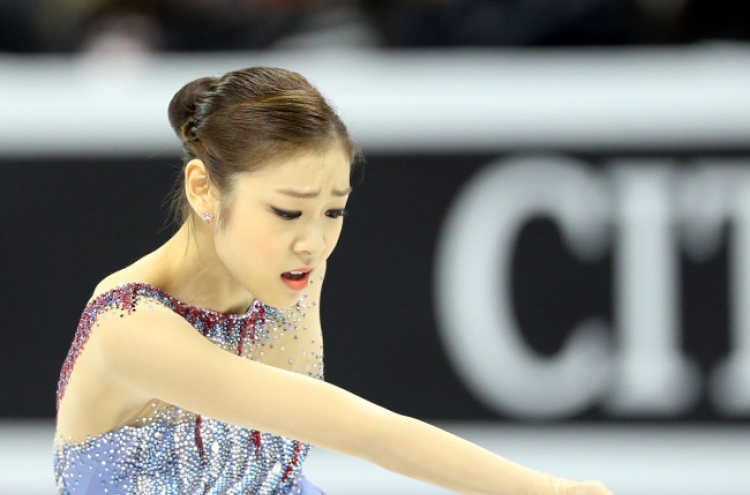 Kim Yu-na leads after short program at world championships
