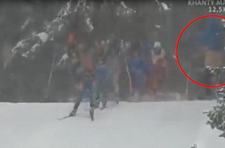 Pervert flashes female skiers at biathlon competition