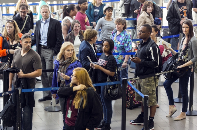 Flight delays pile up amid budget cuts