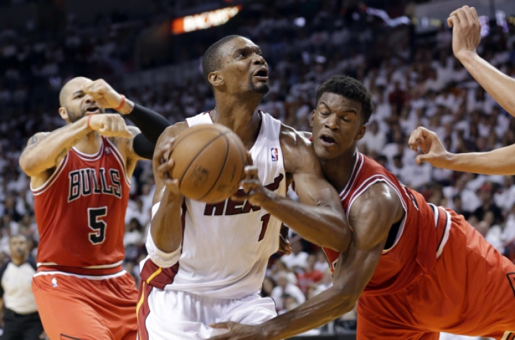 Heat rally past Bulls to advance, 94-91