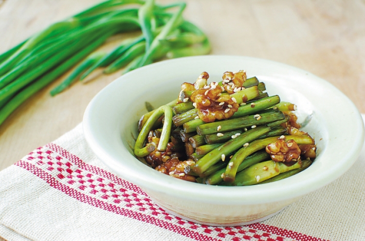 Maneuljjong hodu bokkeum (Stir-fried garlic scapes with walnuts)