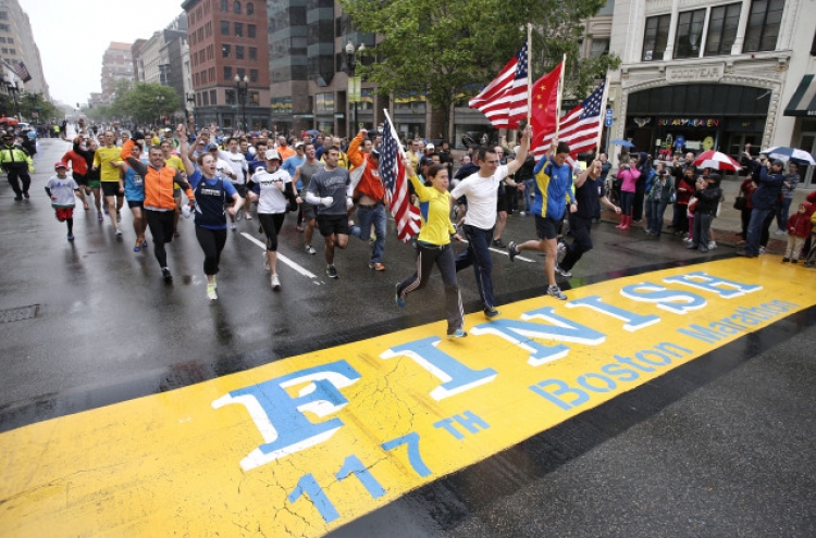 Thousands walk, run final mile of Boston Marathon