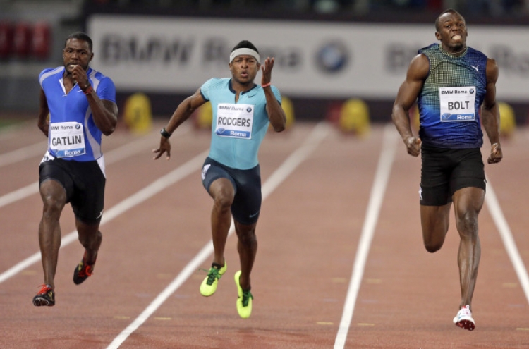 Gatlin edges Bolt by 0.01 seconds