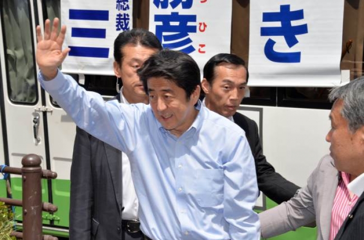 Abe hints at possible delay in tax hike