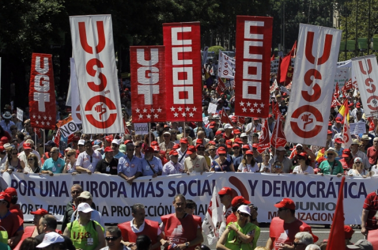 Spaniards march against government austerity